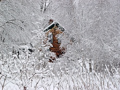 Wood Shingled Cabin Surrounded in Snow After Storm in Maine